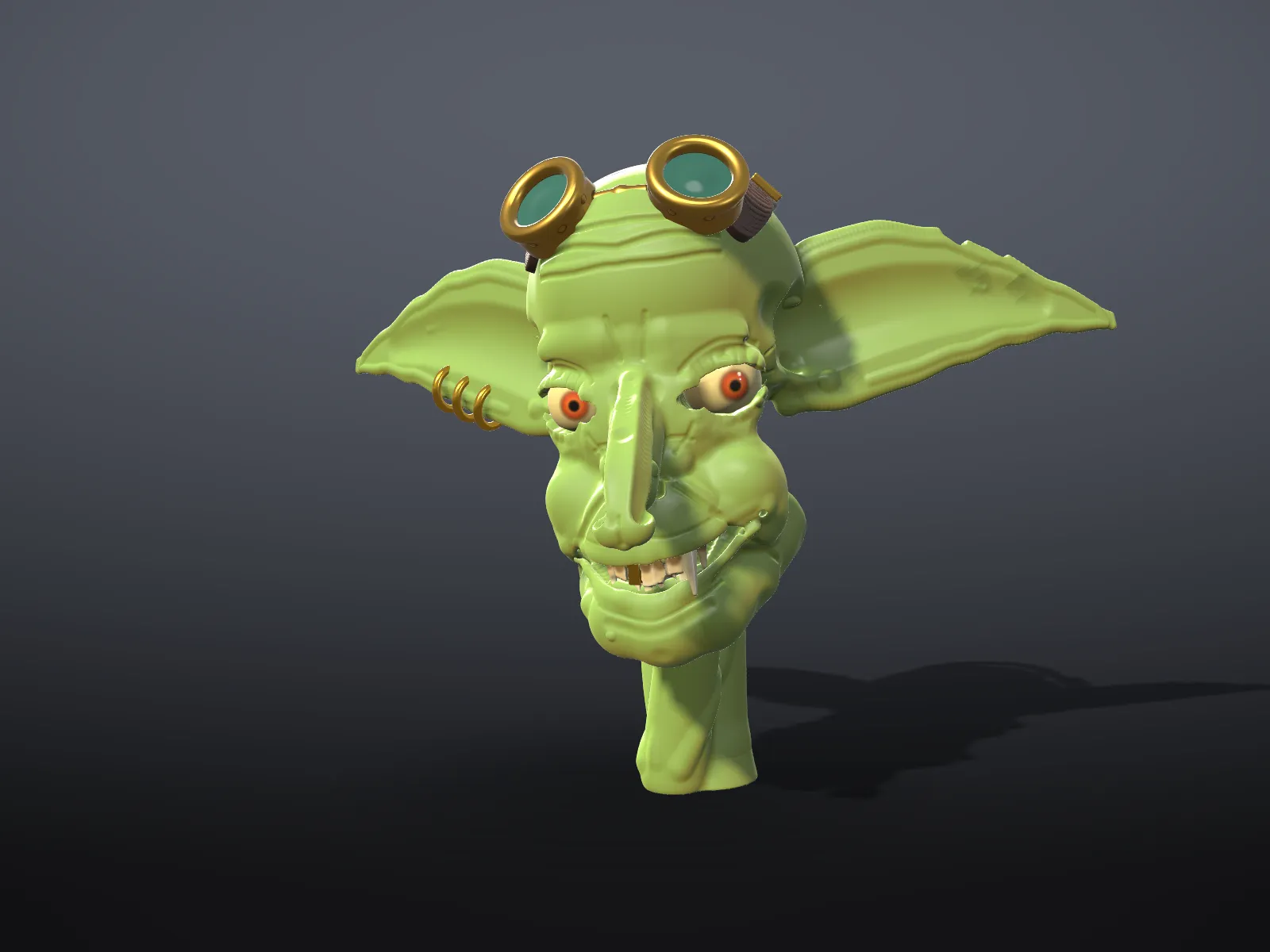 A goblin head in plain clay, built from separate objects for head, ears and goggles